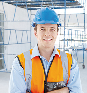 Portrait of a young engineer standing on a construction site